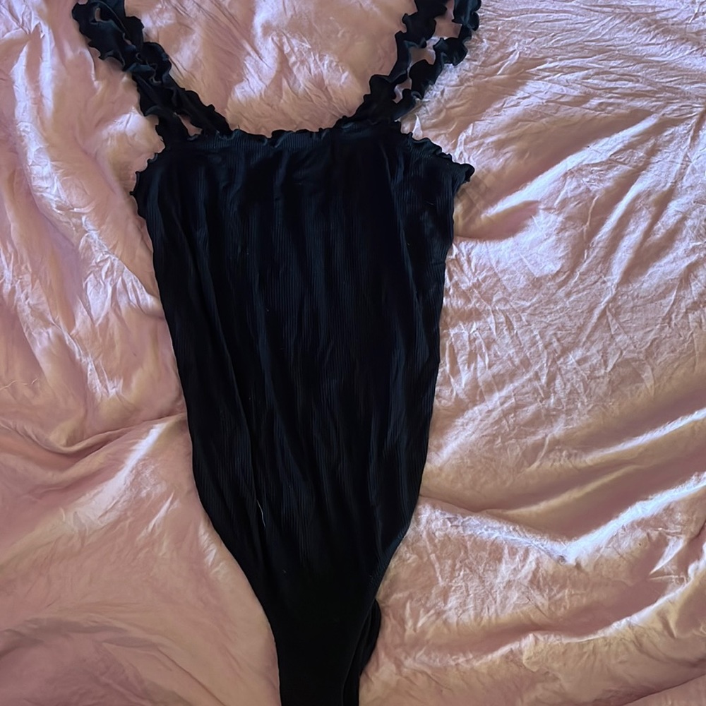Black body suit. Snap bottom